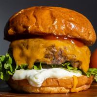The Cheesy Bongo Burger · Melted American cheese on top of a grilled burger served with ketchup, mustard, mayo, lettuc...