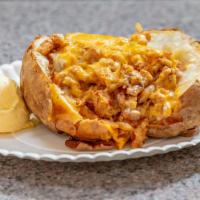 Chicken Baked Potato · Sliced chicken breast with grilled onion and cheese. Served with butter on the side.