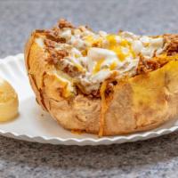 Beef Baked Potato · Sliced beef with grilled onion and cheese. Served with butter on the side.