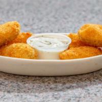 Cream Cheese Poppers · Mild jalapeño pepper halves filled to the max with silky smooth cream cheese, then coated in...