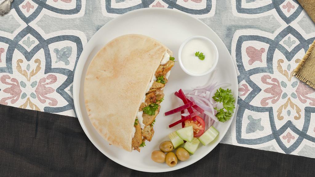 No Better Chicken Shawarma Pita · Marinated chicken, hummus, lettuce, red cabbage, red onion, tahini, tzatziki, and hot sauce wrapped in a warm pita.