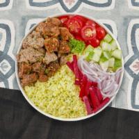 Grill Out Plate · Chicken and lamb shish kebabs, kofte kebab, hummus, green salad, rice, and warm pita bread.