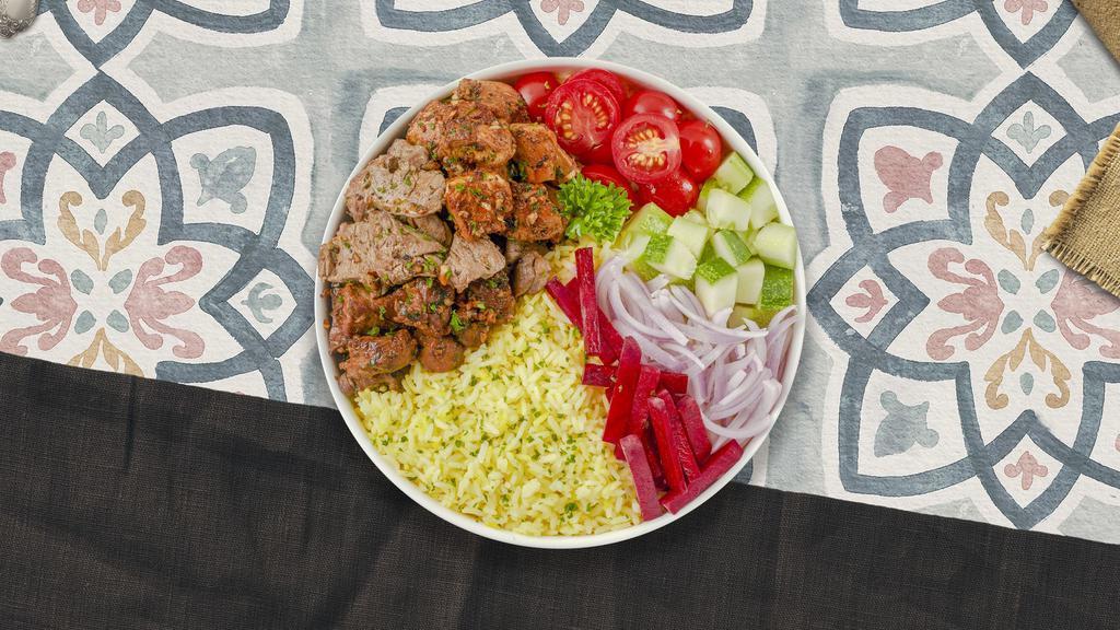 Grill Out Plate · Chicken and lamb shish kebabs, kofte kebab, hummus, green salad, rice, and warm pita bread.