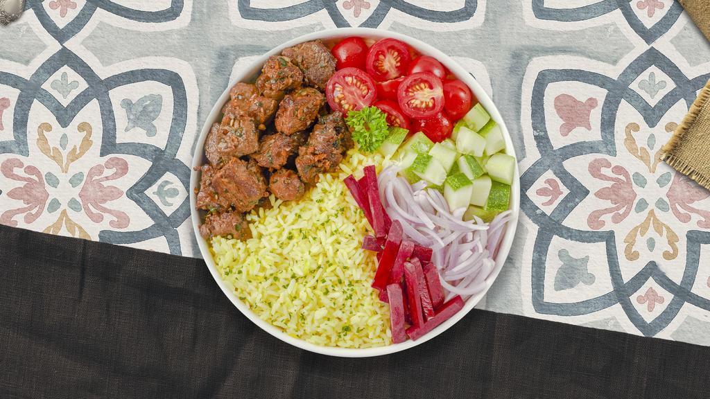 Lady Lamb Kebab Plate · Lamb shish kebab, hummus, green salad, rice, and warm pita bread.