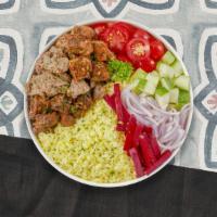 Chicken & Beefy Action Combo Plate · Flavorful chicken and tender beef,  hummus, green salad, rice, and warm pita bread.