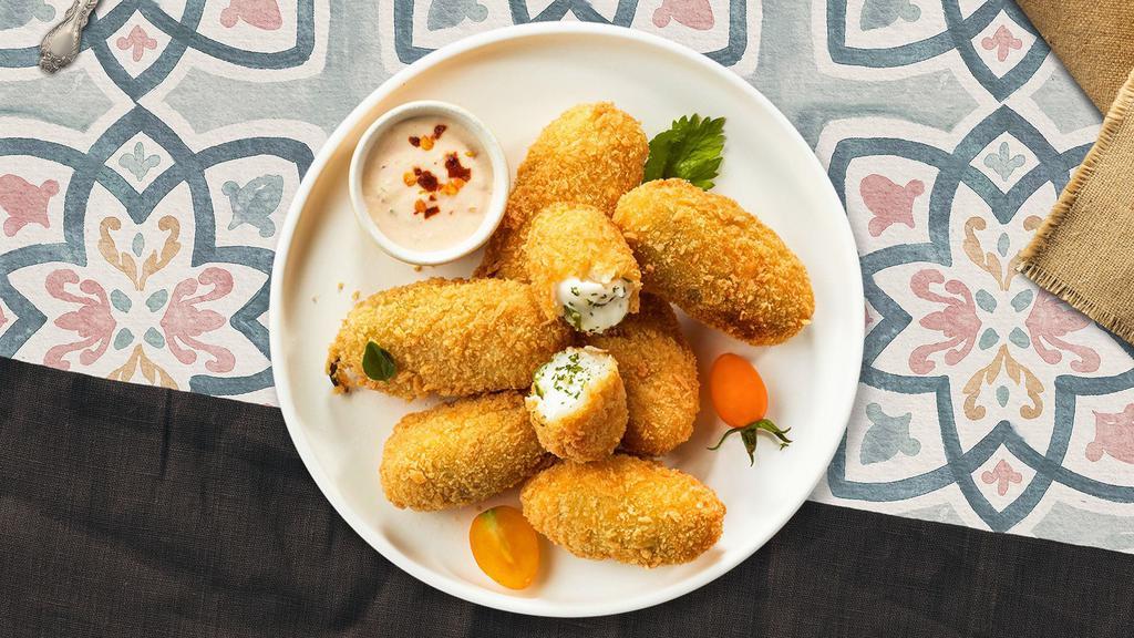 Popper Stopper · Six pieces of crispy golden jalapenos stuffed with creamy cheese and served with savory marinara dipping sauce.