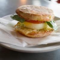 Breakfast Sandwich · Egg, English muffin, tomato, basil, aged swiss.