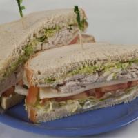 Cranberry Oven Roasted Turkey · Garnished with whole cranberry sauce, lettuce and mayonnaise on harvest white or whole-wheat...