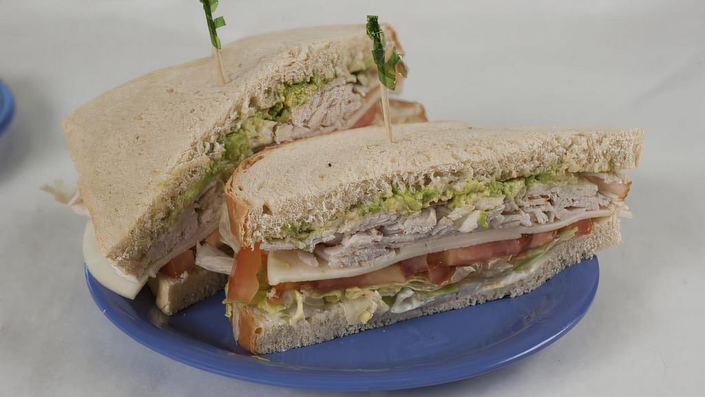 Cranberry Oven Roasted Turkey · Garnished with whole cranberry sauce, lettuce and mayonnaise on harvest white or whole-wheat bread with a dill pickle on the side.