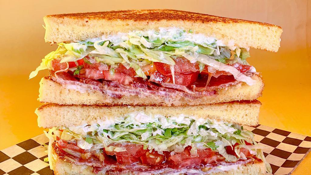 Blt · on Texas toast w/ shredded iceberg, bacon, tomato, and Duke’s mayo