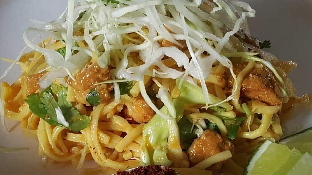 Bd Noodles Salad · Burmese delight noodles salad. Yellow noodles mixed with house dressing, curried chicken, cabbage, gram powder, and green onion.