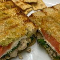 Grilled Chicken Panini · Tender diced chicken in Mediterranean seasoning, toasted on sourdough with avocado spread, f...