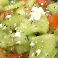 Greek Salad · Tomatoes, cucumber, feta cheese and kalamata olives, tossed in ahouse lemon-mint olive oil d...