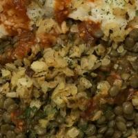 Lentils And Rice Spicy Bowl  · Middle Eastern dish with lentils over rice, topped with spicy tomato sauce & caramelized oni...