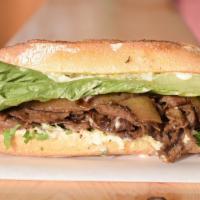 Palomilla Steak · Thin slices of marinated Grade A top-sirloin beef seared on a flat-top. Sandwiches are slath...