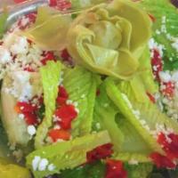 Salad · Whole head of romaine lettuce, ripped with an artichoke heart, roasted red peppers, kalamata...