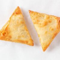 Vegetable Samosa · One crisp pastries stuffed with potatoes and peas or one crisp pastry.