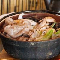 Sukiyaki · Sliced beef and vegetable stew with Japanese rice noodle sukiyaki sauce.