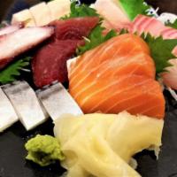 Sashimi Deluxe · 19 pieces, assorted sashimi, side white rice.