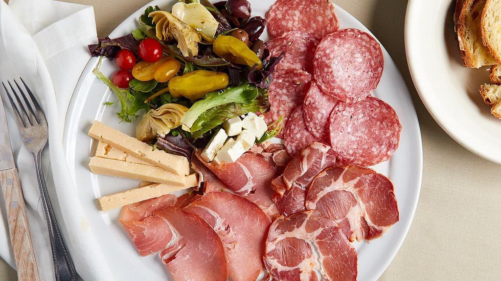 Misto · Prosciutto, salami, coppa, kasseri cheese, feta cheese, artichoke hearts, Greek olives, peppers, tomatoes, and mushrooms.