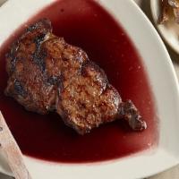 Wine Steak · Rib-eye marinated in red wine with garlic.