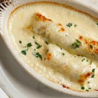 Seafood Cannelloni · Crepes stuffed with crab, shrimp, mushrooms, and spinach; baked in cream sauce with mozzarel...