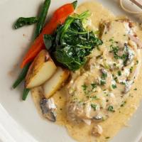 Chicken Phillipo · Breaded chicken with mushrooms and onions in a cream sauce.