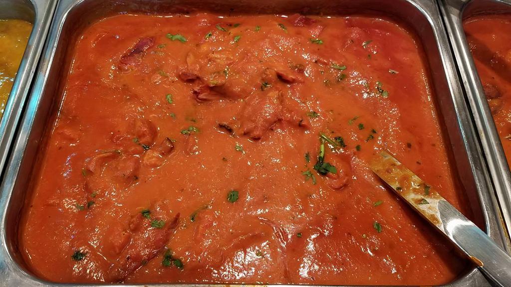 Murgh Makhani (Butter Chicken) · Tandoori chicken in a creamy, tomato butter sauce.
