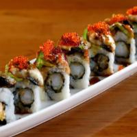 Dragon Roll · Shrimp tempura, surimi crab, cucumber inside topped with eel and avocado & served with eel s...