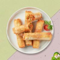 Eggin' Veggie Roll · (2 pieces) Crispy egg roll stuffed with beef, egg, celery, cabbage. Served with housemade sw...