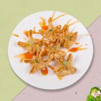 Cautious Crab Rangoon · (4 pieces) Golden fried wontons stuffed with cream cheese and crab meat Served with sweet an...
