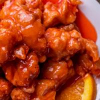 Orange Chicken · Crispy deep-fried chicken leg meat cooked with sweet and spicy orange sauce.