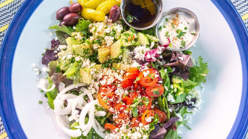 Greek Salad 🥗 · Mixed greens topped with onion, English cucumber, grape tomato, Kalamata olives, feta cheese, pepperoncini choice of dressing: creamy tzatziki or extra virgin olive oil and balsamic vinegar. Add meat for an additional charge.