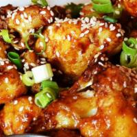 Cauliflower Wings · Pan-fried cauliflower florettes tossed with your choice of sauce!