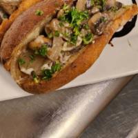 Mushroom Melt · A savory, smoky mixture of tempeh, mushrooms and onion on a toasted baguette with melted moz...
