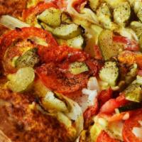 The Grickle Pizza · Nacho cheese sauce, diced grilled garlic pickles, onion, tomato and black pepper. It might s...