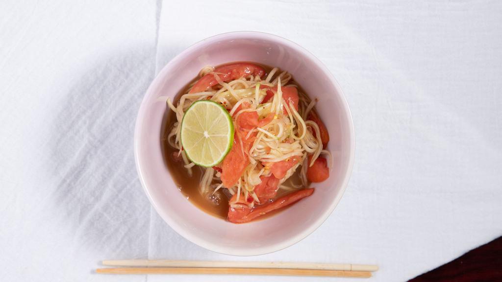 Papaya Salad · Shredded papaya, tomato and chili mixed with house special sauce and lime served with cabbage.