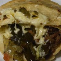 Rajas Con Queso · Handmade gordita of corn or flour with green chili, mozzarella’s cheese and refried beans.