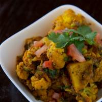 Aloo Gobi · Gluten free. Cauliflower with potatoes cooked with fresh ginger, onions and spices.