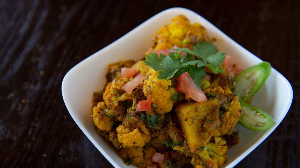 Aloo Gobi · Potatoes and cauliflower cooked with special spices.