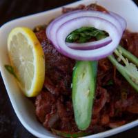 Pepper Chicken · Gluten free. Bone-in chicken sautéed with black pepper, onions and spicy sauce.
