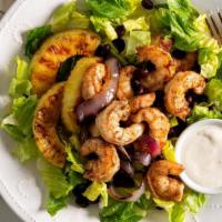 Jerk Shrimp Salad · Fresh chopped greens topped with grilled jerk shrimp, tomatoes, onions, cheese. Served with ...