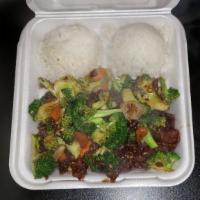 Broccoli Beef · Thick cut steak tips stir fried in our signature stir-fry sauce with tender broccoli, carrot...