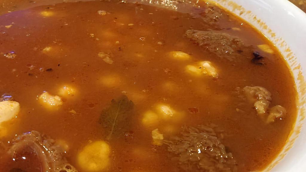 Menudo · A truly authentic Mexican soup. Tender, slow-cooked Tripe in a natural Broth. Served with or without Hominy. Choice of Flour or Corn tortillas.