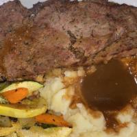 Momma'S Meatloaf · Savory homemade beef meatloaf served with mashed potatoes and gravy.