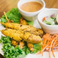Satay · Marinated chicken in a mixture of spices, herbs and coconut milk. Grilled and served with pe...