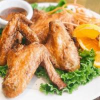 Chicken Wings · Marinate in spices, garlic, pepper, soy and oyster sauce. Golden brown deep fried and served...