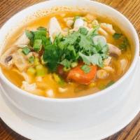 Tom Yum Bowl · Thai style hot and sour soup in clear broth with mushrooms and tomatoes, a touch of lemon gr...