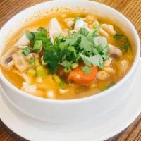 Tom Yum Cup · Thai style hot and sour soup in clear broth with mushrooms and tomatoes, a touch of lemon gr...
