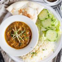 Bengun Bhartha · Roasted eggplant sauteed with peas, garlic, onion, and tomatoes. (Gluten Free)